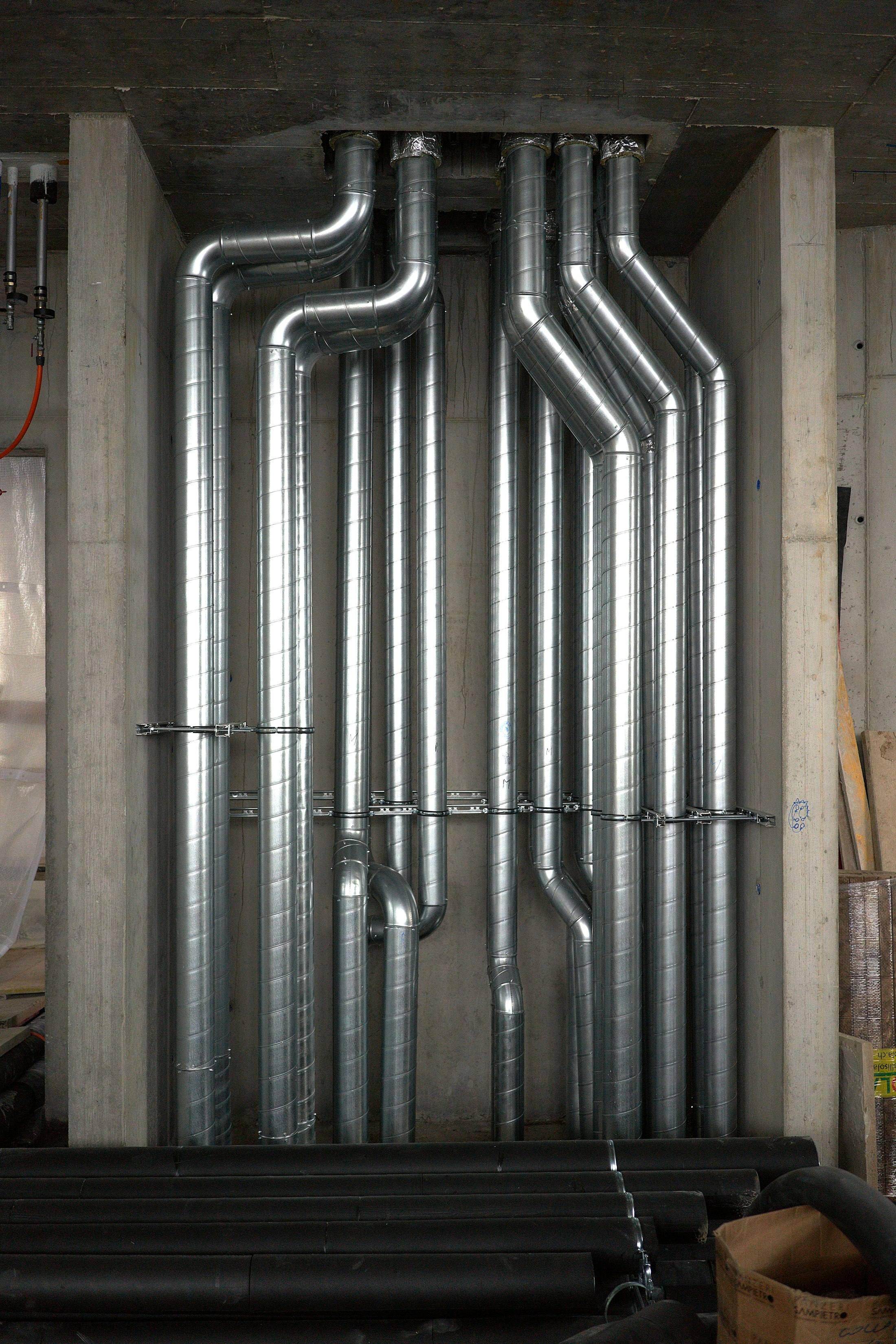 Vertical ducts and pipes running through a plant space