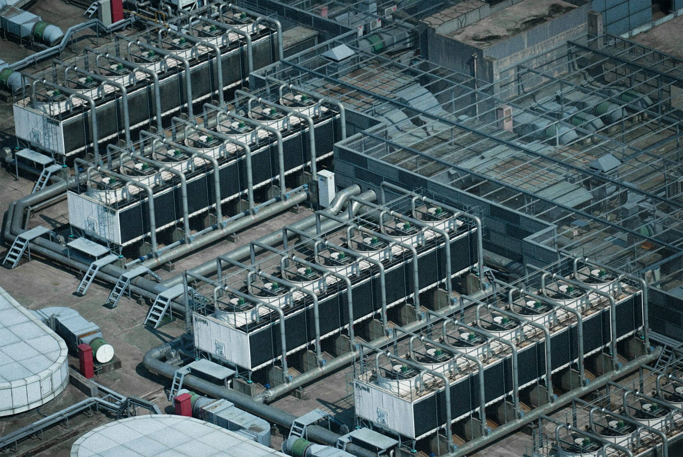 Aerial view of a large array of rooftop cooling equipment